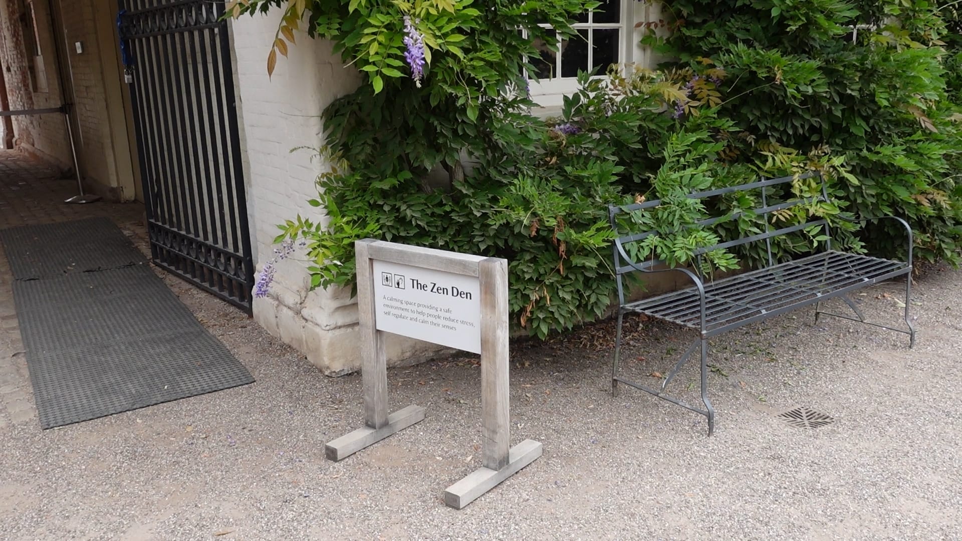 A white sign saying "The Zen Den" on it, along with information about what it's for