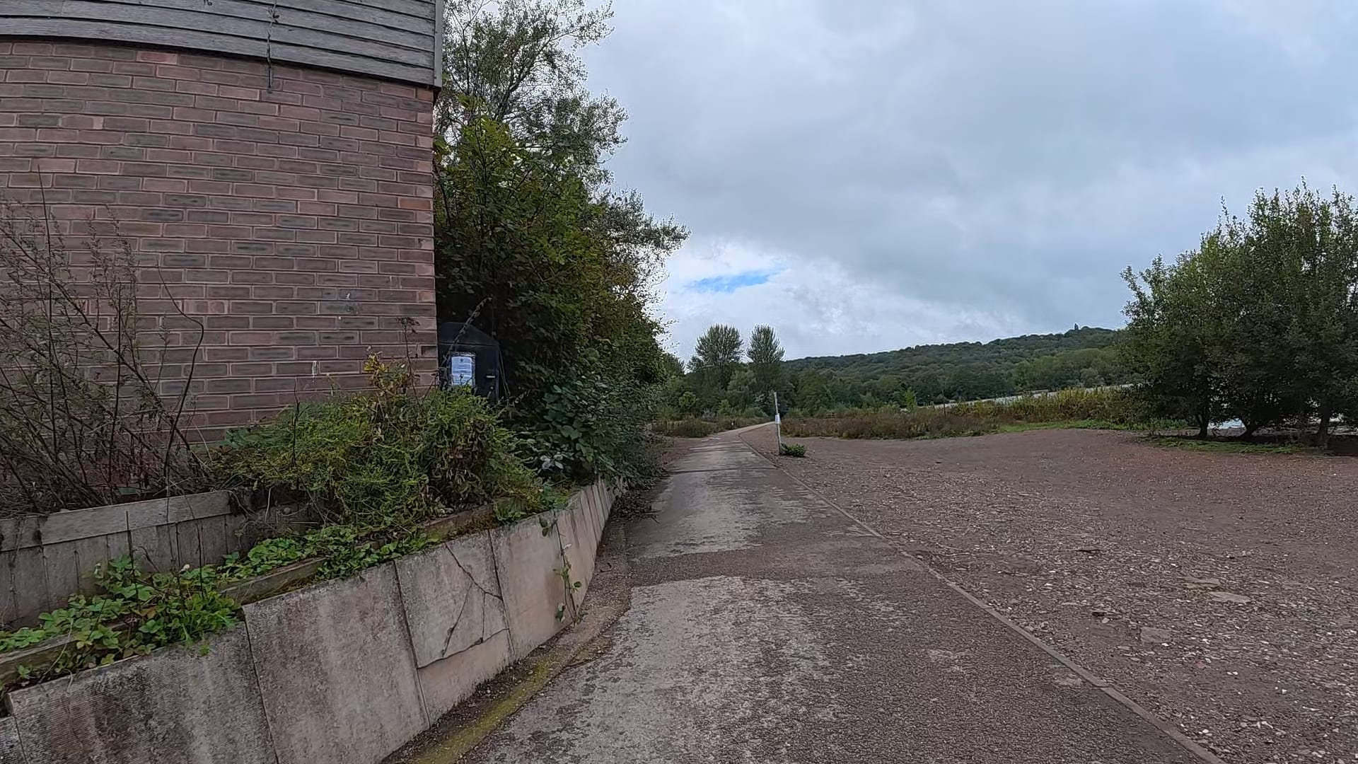 The Green Door building is to the left and the path stretches out in front of us.