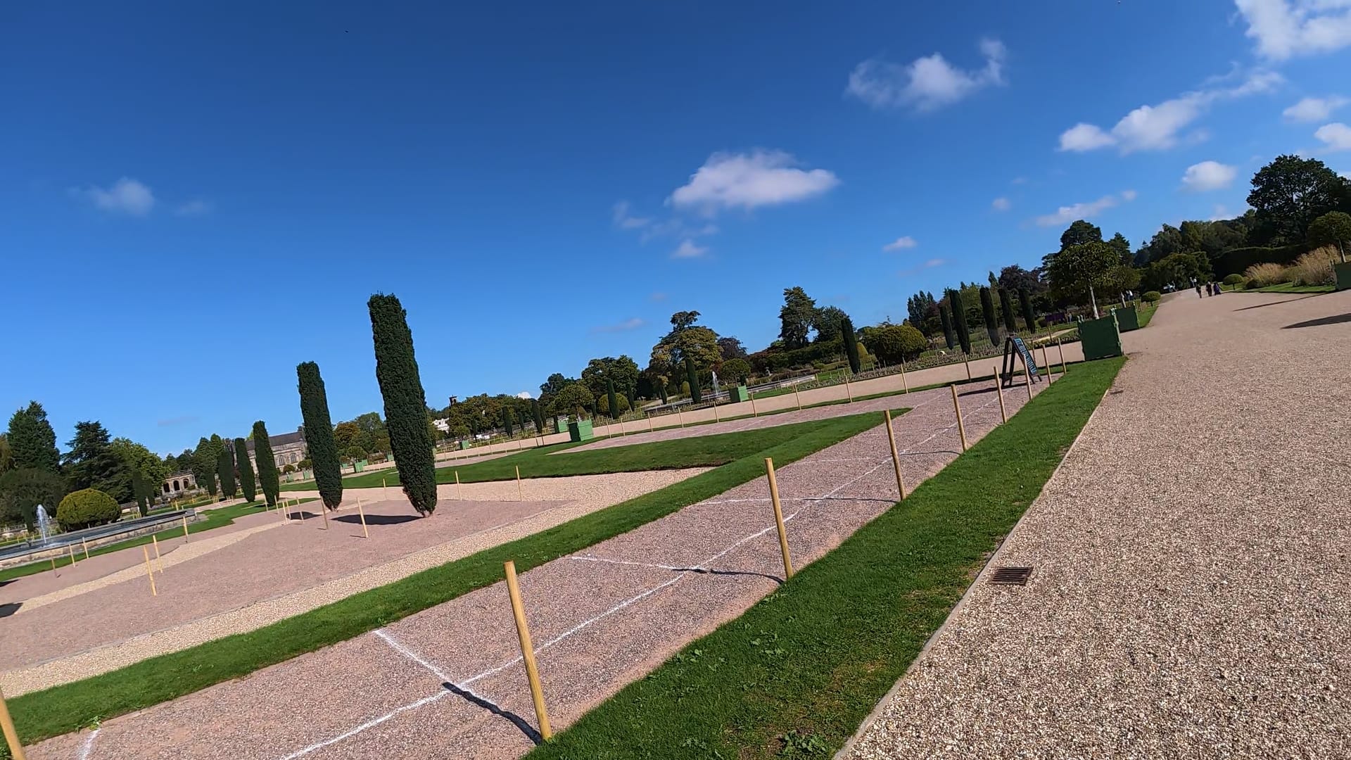 Looking over the gardens. There are stakes in the ground and areas marked out with white paint, ready for the new plants