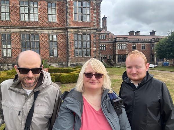 John, Sue and George standing outside the country house at Sudbury